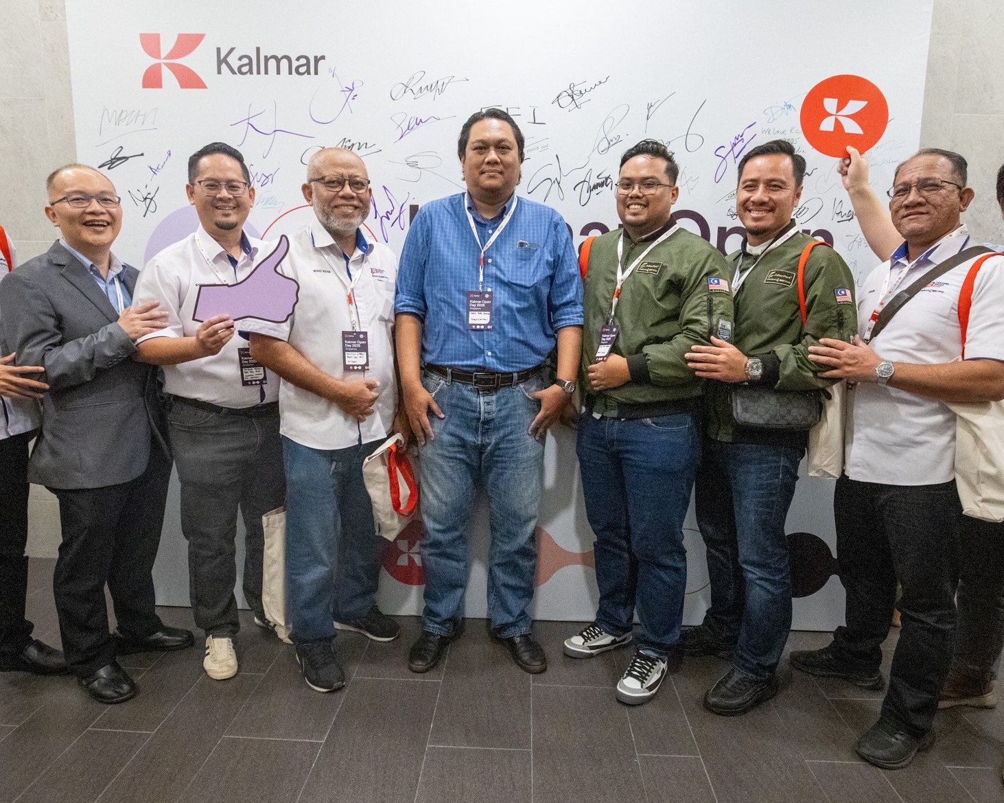 Mach 1 team with customers attending Kalmar Singapore Open Day, engaging in industry discussions and networking.