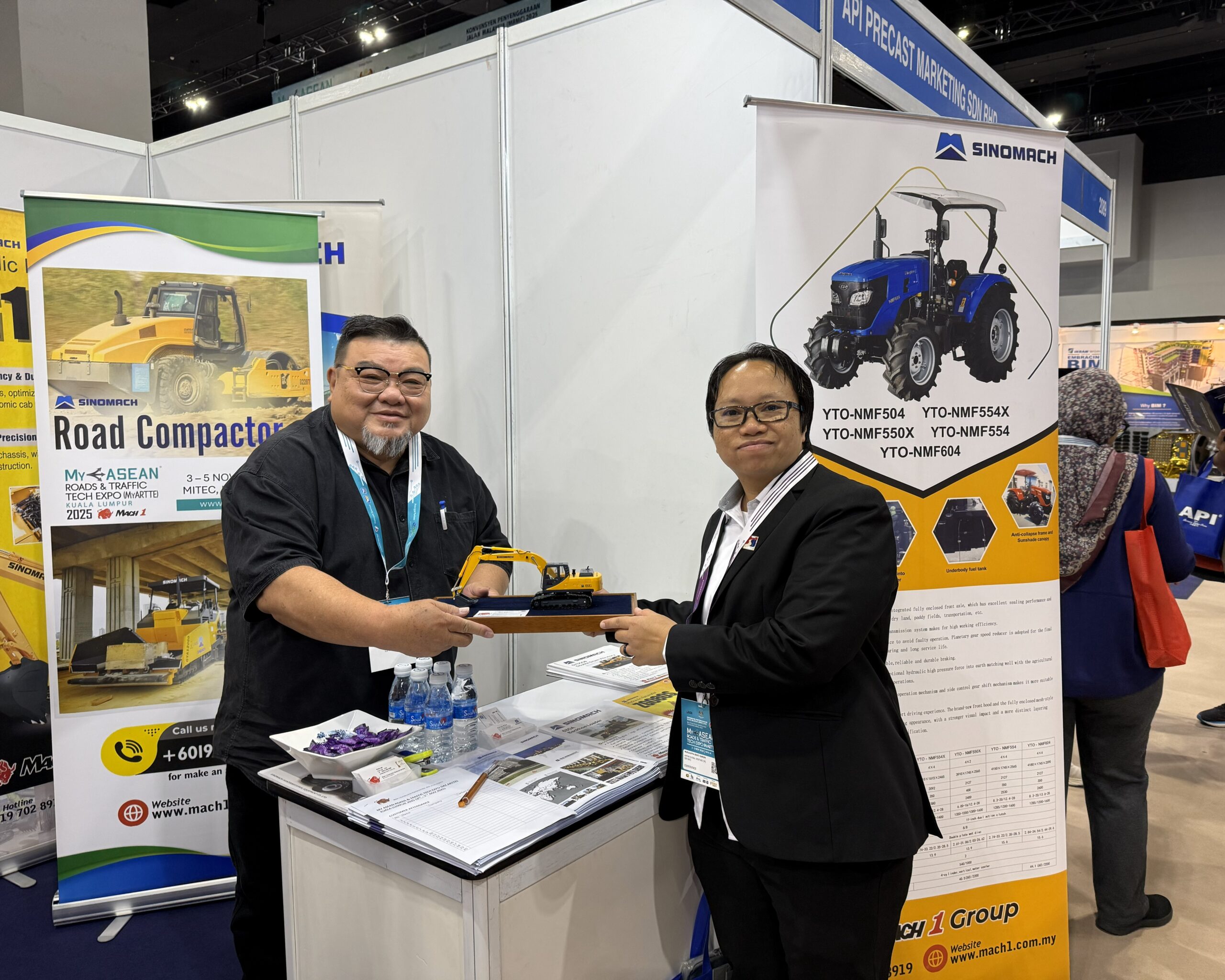 Visitors engaging with Mach 1 Group’s booth showcasing SINOMACH road construction machines at MyASEAN Roads & Traffic Tech Expo 2025