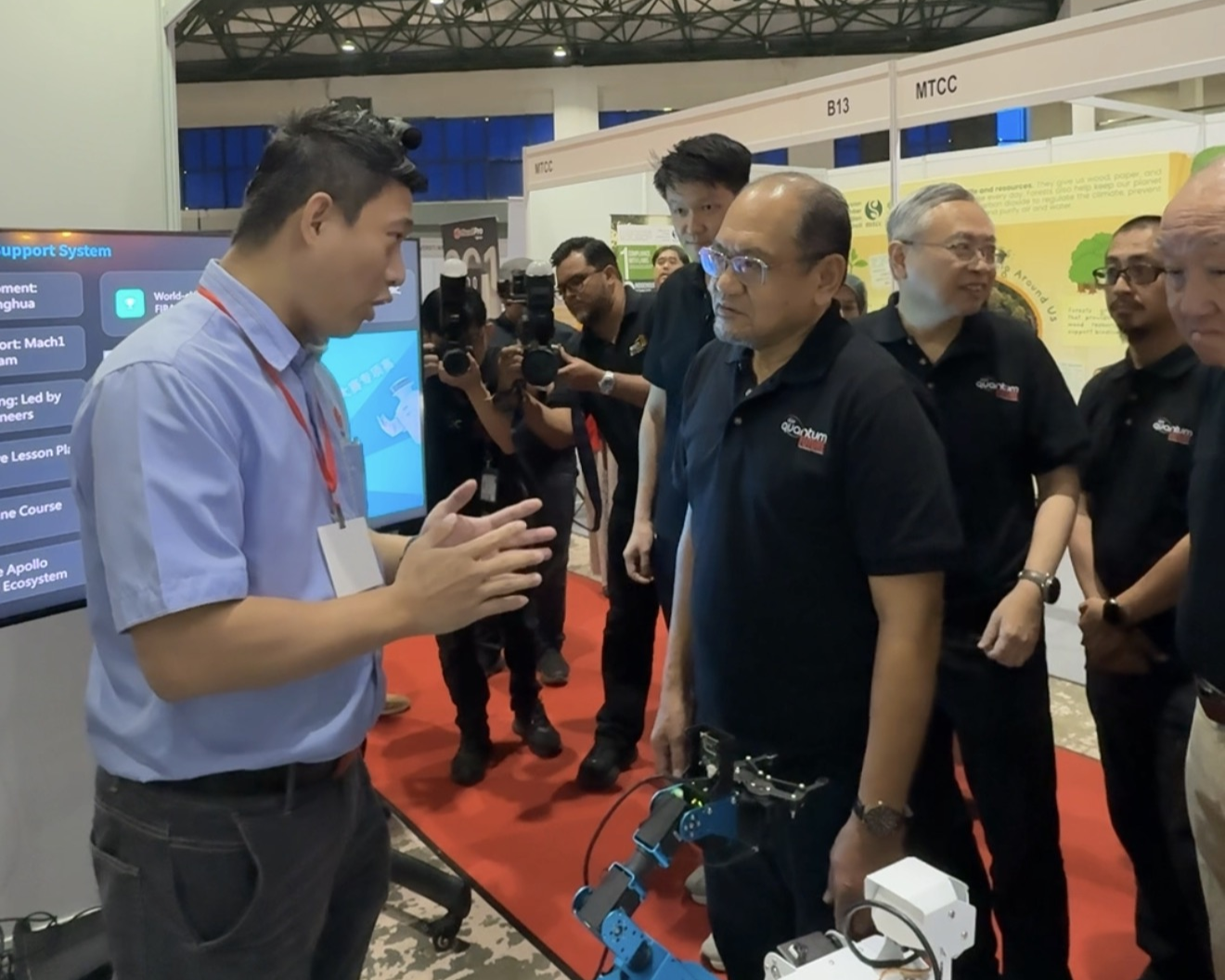 Mach 1 Group team presenting robotics innovations to YBhg. Datuk Seri Hasnol Zam Zam, Secretary-General of MOSTI, at the KLESF 2025 booth