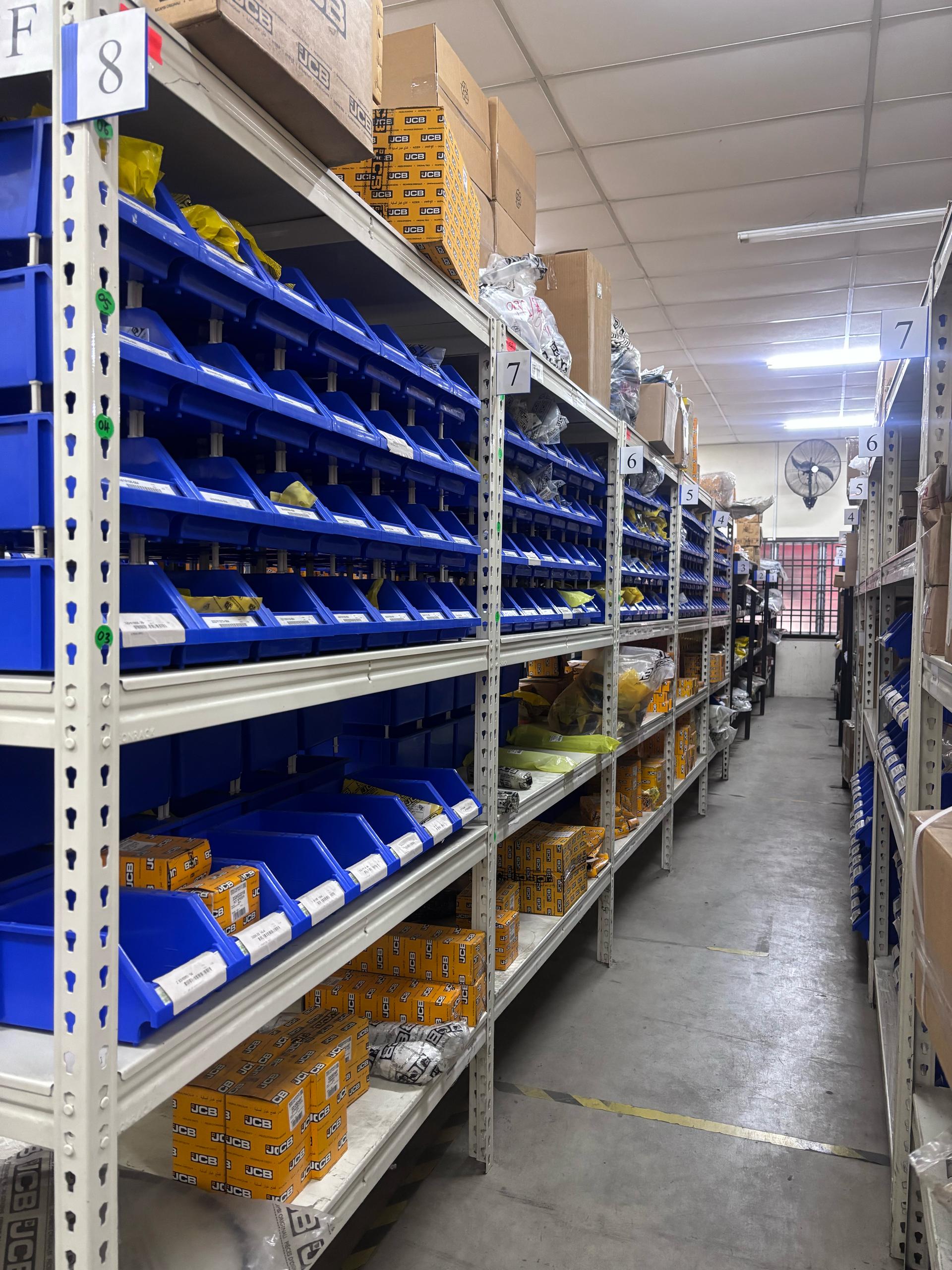 Spare parts warehouse with organized shelving and inventory storage